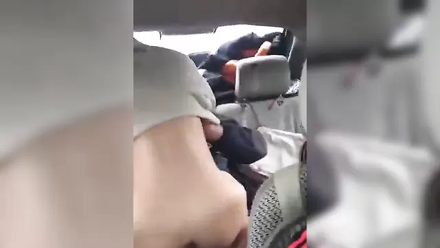 Skinny babe gives blowjob in car to Asian babe